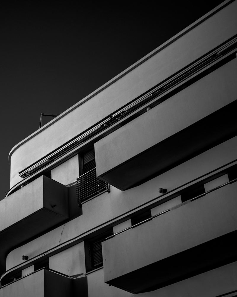 Curved balconies of a Bauhaus building in Tel Aviv's White City