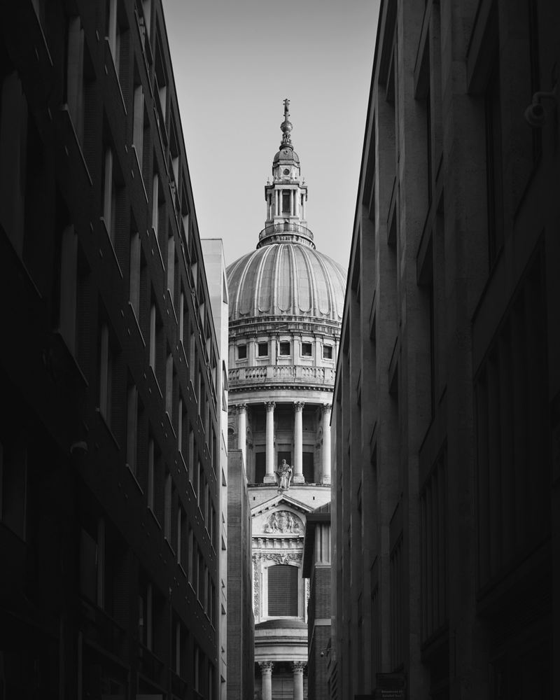The dome of St Paul's Cathedral framed by office buildings in the City of London
