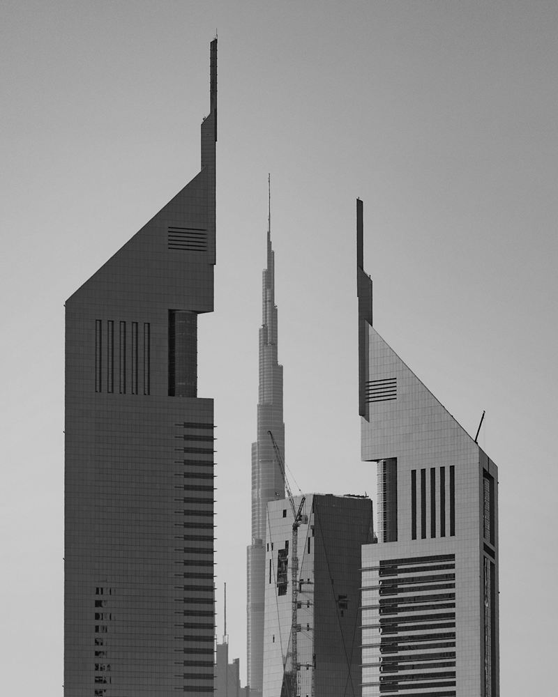 The Emirates Towers in Dubai framing a distant skyline