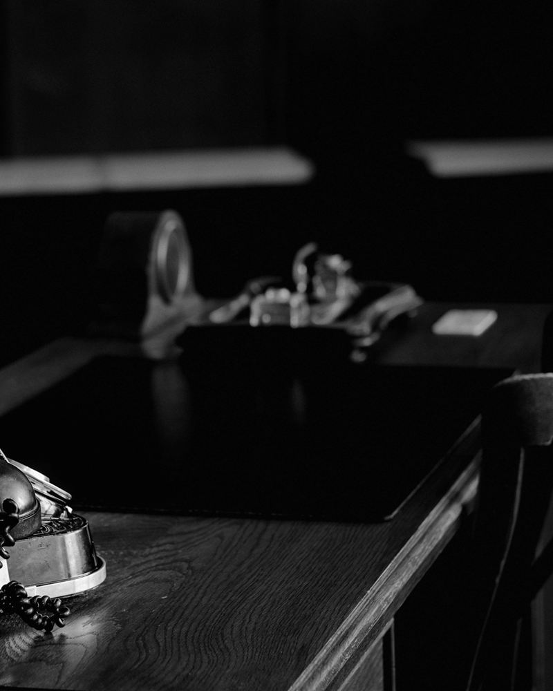 A quiet study desk with a lamp in low light
